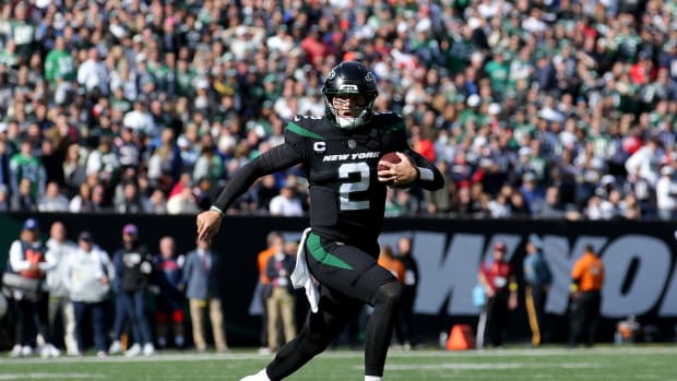 New York Jets QB Zach Wilson runs with football against New England Patriots